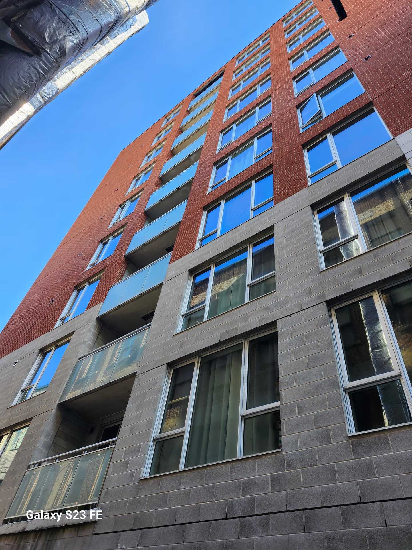 Les Condos Flex — Nettoyage de vitres en accès sur corde